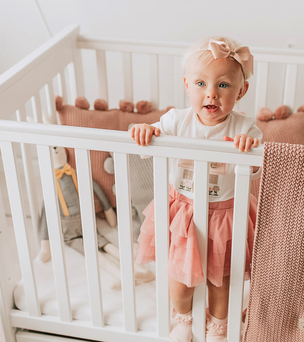 כרית פומפונים ורוד